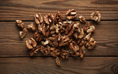 Walnuts without shell on a wooden table