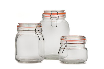 Three glass jars with tight-fitting lids for bulk products on a white background.