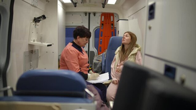 A pregnant girl is taken to the hospital in an ambulance, where a paramedic talks to her and records her words