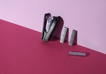 Black Stapler with bullets starting on pink background. Creative layout