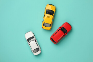 Car and taxi models on blue background. Travel, vocation concept