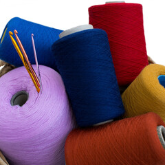 large spool of thread, knitting yarn, multi-colored threads