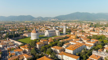 Pisa, Italy. The famous Leaning Tower and Pisa Cathedral in Piazza dei Miracoli. Summer. Evening hours, Aerial View