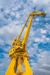 yellow crane on sky background