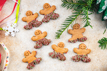 Fototapeta na wymiar gingerbread man christmas gingerbread cookies cinnamon, vanilla, ginger christmas sweet dessert holiday baking treat new year and celebration meal food snack on the table copy space food background