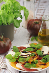 A plate with Italian salad caprese