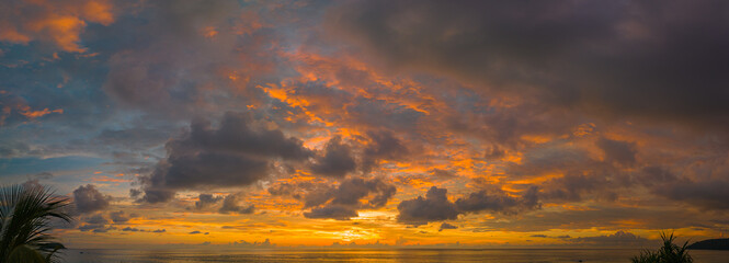 .aerial view amazing sky in sunset above the ocean at Karon beach Phuket..Imagine a fantasy bright yellow clouds changing in colorful sky..Gradient color. Sky texture, abstract nature background.