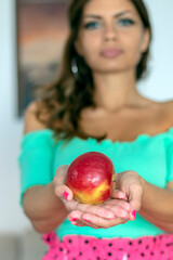 Woman Holding an Apple