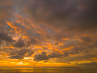 .aerial view amazing sky in sunset above the ocean at Karon beach Phuket..Imagine a fantasy bright yellow clouds changing in colorful sky..Gradient color. Sky texture, abstract nature background.