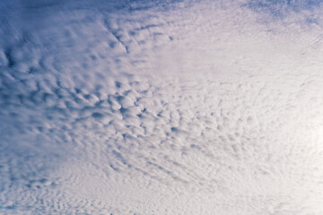 Blue cloudy sky with cirrus clouds. Ornamental clouds. Background.