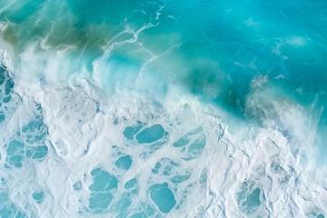 view of turquoise ocean water with splashes and foam for abstract natural background and texture