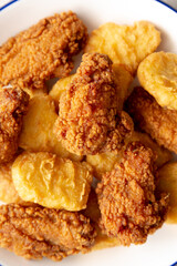 Homemade Chicken Nuggets and Chicken Wings with Ketchup, top view.