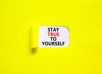 Stay true to yourself symbol. Concept word Stay true to yourself on beautiful white paper. Beautiful yellow paper background. Business stay true to yourself concept. Copy space.