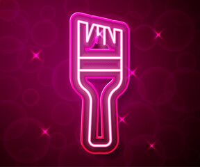 Glowing neon line Paint brush icon isolated on red background. Vector