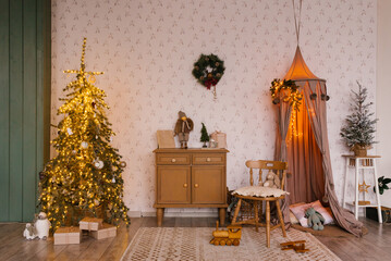 Fabulous Christmas interior of a children's room with a Christmas tree and an awning with toys