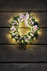 Large Christmas wreath on the wall.