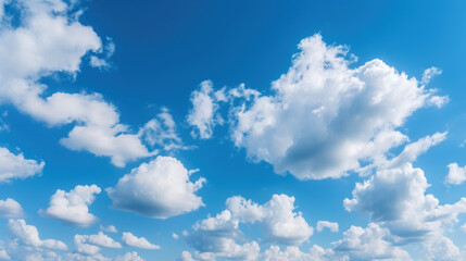 Naklejka na ściany i meble Sunny day with beautiful blue sky and white cumulus clouds