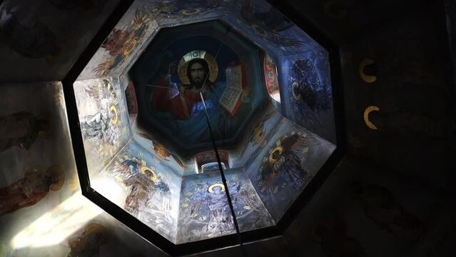 christian orthodox images on the dome or ceiling of a temple or church in the evening or in the dark