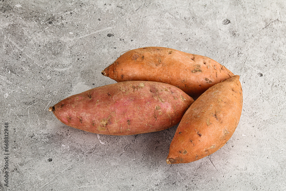 Wall mural Raw ripe sweet potato heap