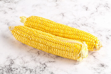 Sweet yellow raw corn cob