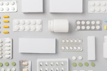 Poster Flat lay with different pills in blister packaging and boxes and on color background © Liami