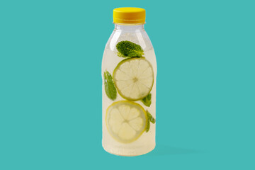 Mojito lemonade with lemon, lime, mint, mojito syrup, ice, sparkling water on green background for...