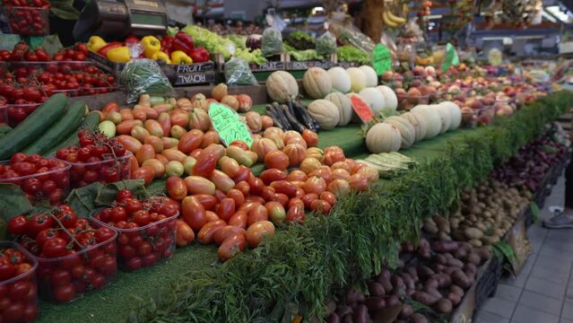 Tomatoes and melons on fresh fruit stall in Mercato Coperto di Rimini, Rimini, Emilia Romagna, Italy