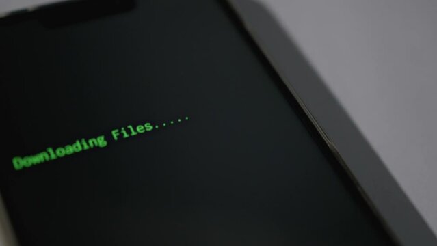 Phone Hacking Cyber Attack Ransom Downloading Files Close up