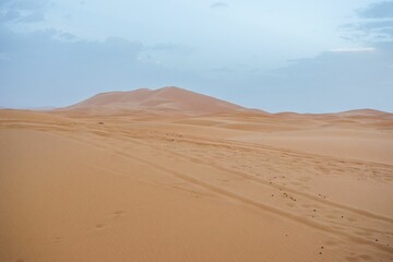 Fototapeta na wymiar Sand dunes during sunset in Erg Chebbi desert, near Merzouga, Sahara Desert, in Morocco.