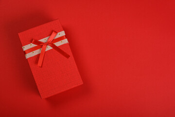 Red gift box with ribbon bow