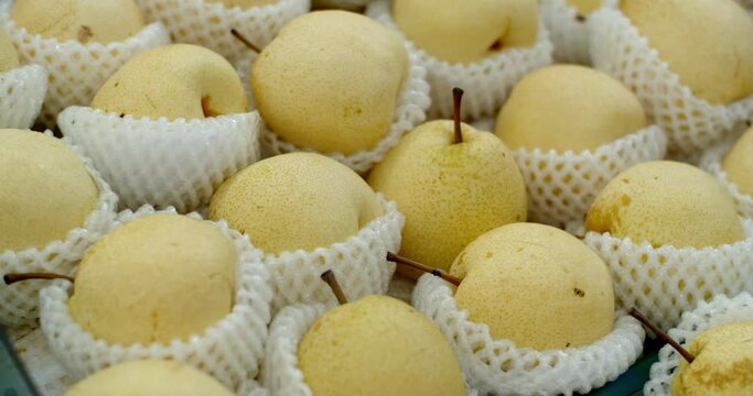 Asian pear fruit sold in the super market in Thailand.Many yellow ripe Asian pear.Fresh ripe asian pear for sale at the market.