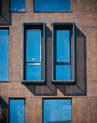 Rectangular vertical windows in the building.