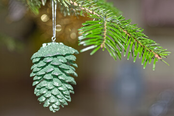 Green cone hanging on christmas tree - 668842749