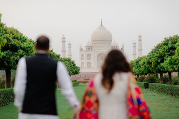 couple  with the view of Taj Mahal in Agra, India