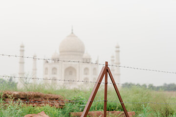 couple  with the view of Taj Mahal in Agra, India