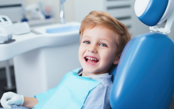 A happy child sitting in the dental chair at a dentist