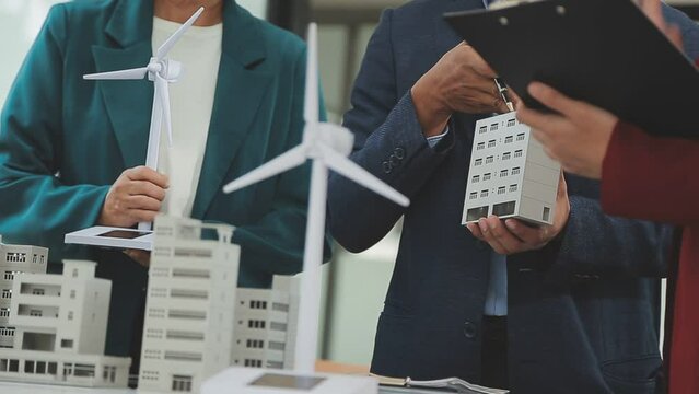 Business team people meeting and talking with engineer and architecture about planning and drawing of building construction project, smart executive professional working at outdoor, teamwork concept