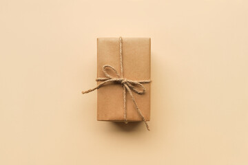 gift box packed in craft brown paper, top view, flat lay. Christmas and New Year gifts, gift...