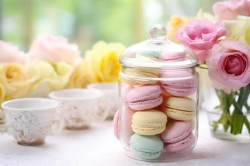 Foto op Canvas a table with pastel-colored macarons in a glass jar © Alfazet Chronicles