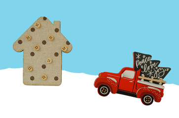 decorative wooden house and car with Christmas tree. wooden toys. new year. holiday concept