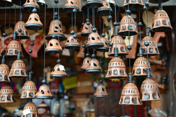 Lots of handmade clay bells. ceramic souvenirs at the bazaar