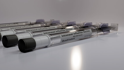Syringes containing intranasal flu vaccine doses - obrazy, fototapety, plakaty