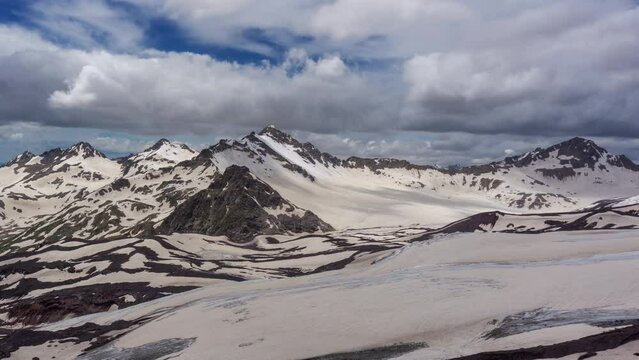 Beautiful landscape with snow covered peaks of the Caucasus Mountains, Russia, timelapse 4k