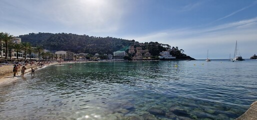 Port de Sóller is a village and the port of the town of Sóller, in Mallorca, in the Balearic Islands, Spain. Along with the village of Fornalutx and the hamlet of Biniaraix they combine to form Sóller