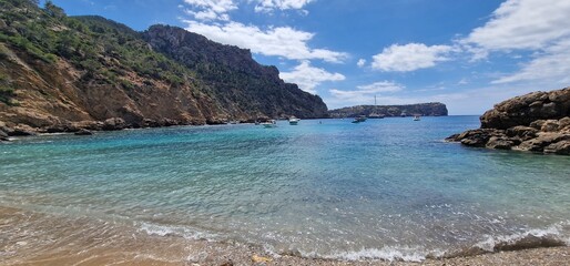 Cala de Egos, virgin beach of boulders located in the municipality of Andratx. Cala d'Egos beach is located on the rugged coast of the municipality of Andratx. It is a virgin beach with small boulders