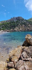 Obraz premium Cala de Egos, virgin beach of boulders located in the municipality of Andratx. Cala d'Egos beach is located on the rugged coast of the municipality of Andratx. It is a virgin beach with small boulders