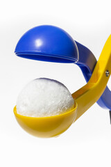 Yellow and blue plastic snow ball maker for winter fun on holidays with a snowball