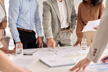 Executive business team people group working with paperwork standing at table, analyzing corporate strategy concept, reviewing plan, managing financial project overview at office meeting, close up.