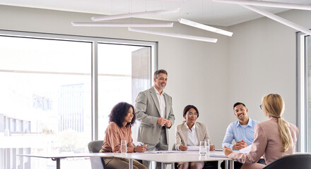 Busy international executive company team leaders discussing work plan at board meeting. Diverse...