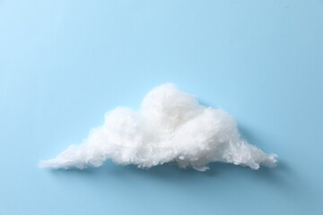 Cloud made of cotton on light blue background
